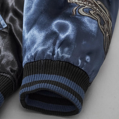Close-up of navy satin sleeve and striped ribbed cuff on Storm Dragons & Peony dragon bomber jacket.