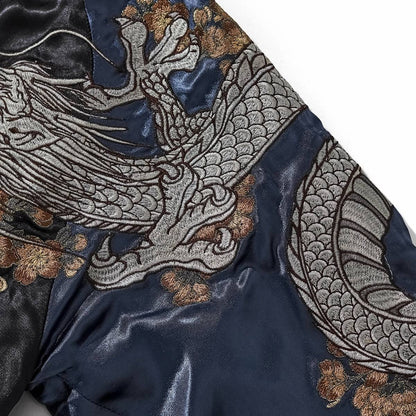 Close-up of storm dragon body and claws wrapping the navy sleeve on Storm Dragons & Peony sukajan jacket.