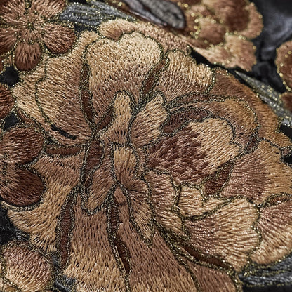 Macro detail of dense gold-outlined peony blossom embroidery on Storm Dragons & Peony sukajan jacket.