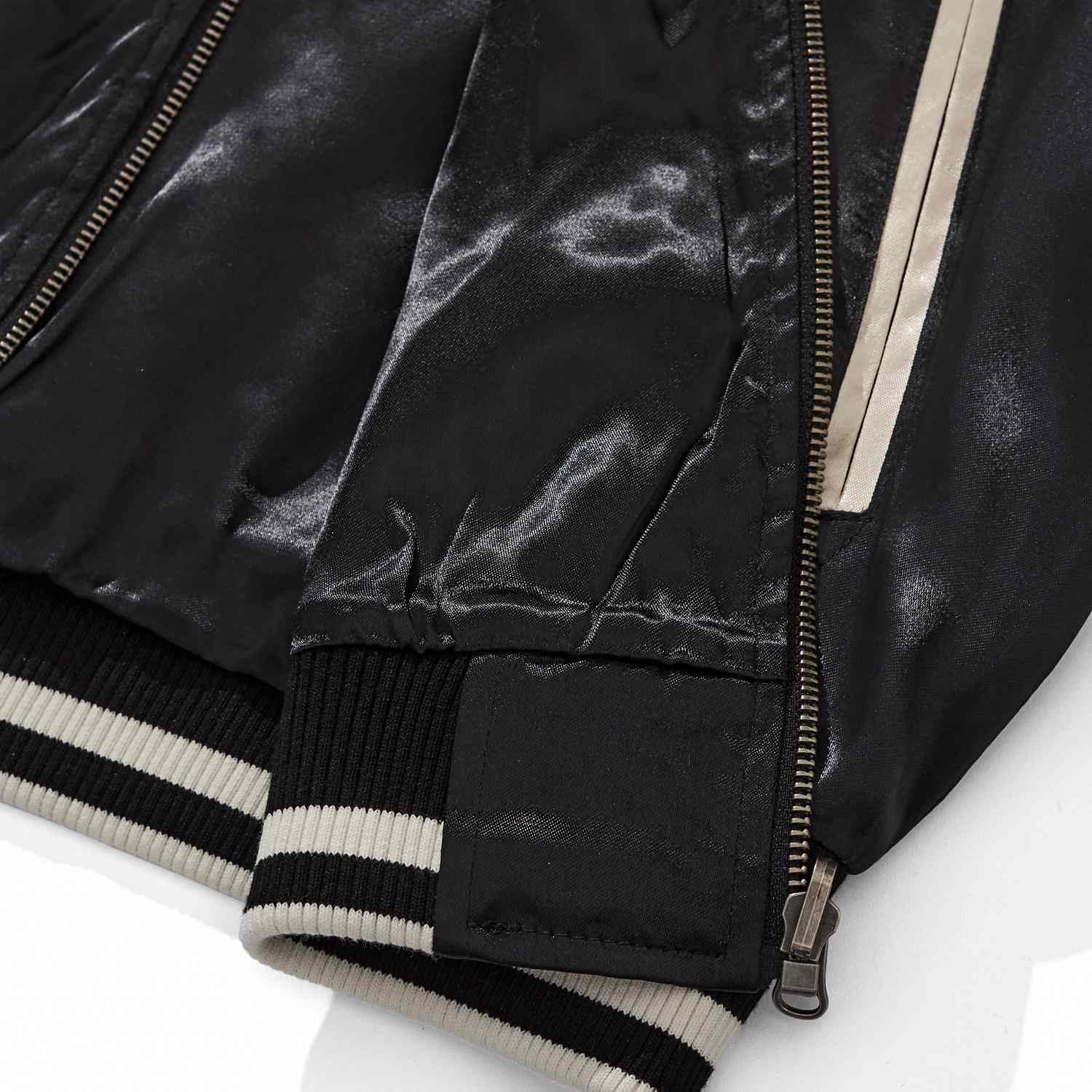 Hem and zipper base—striped rib hem with metal zipper guard.