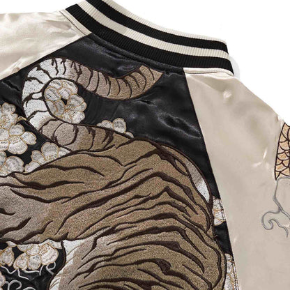 Shoulder detail—tiger tail sweeping across blossoms.