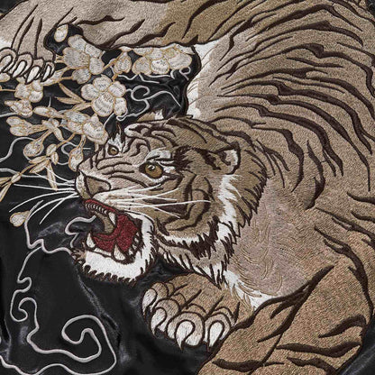 Close-up of tiger face and paw with blossoms and smoke lines.