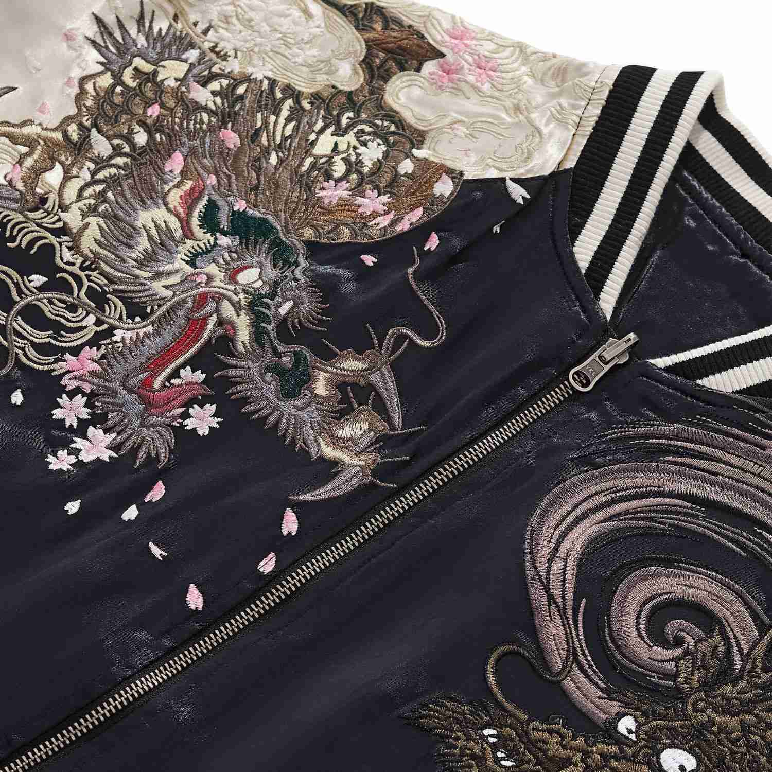 Close-up of fierce dragon face and sakura petal embroidery on Twin Dragons & Sakura Japanese sukajan jacket.