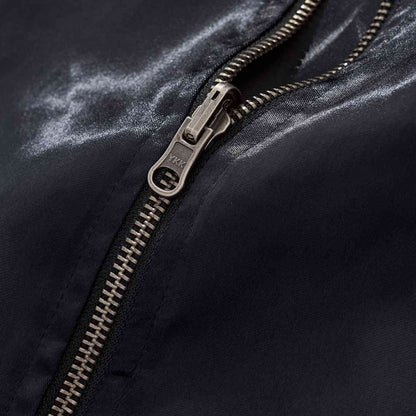 Close-up of sturdy YKK zipper on the navy body of Twin Dragons & Sakura embroidered sukajan jacket.