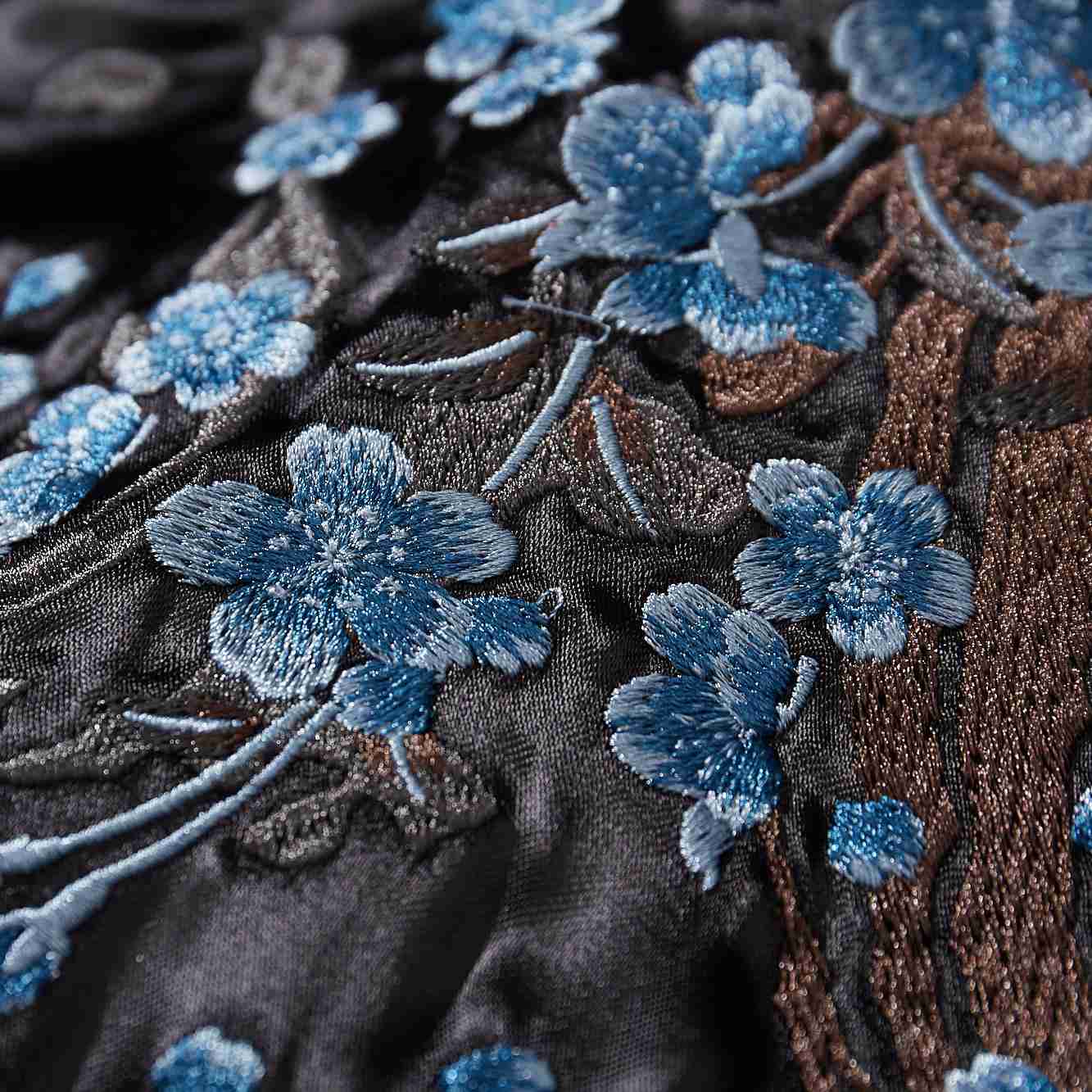Textured blue blossoms and branches with 3D embroidery.