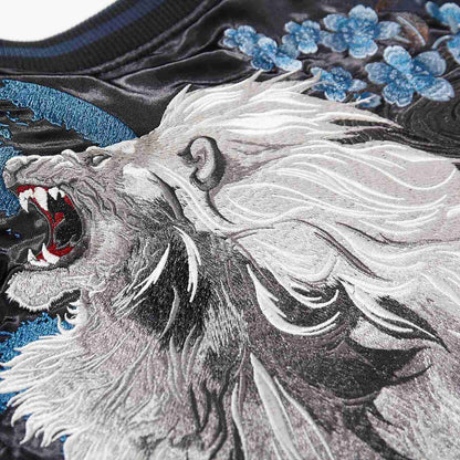 Lion mane, blue moon disk, and blossoms—rich, high-density stitchwork.