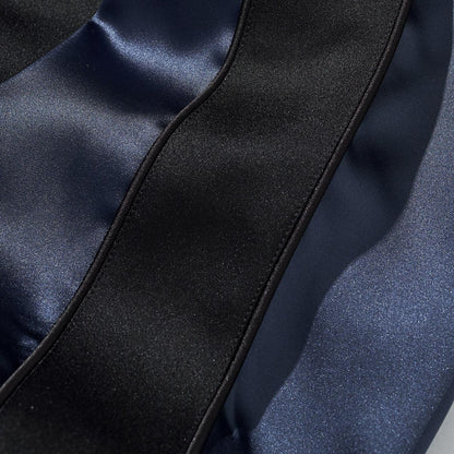 Satin sleeve panel detail with black side stripe