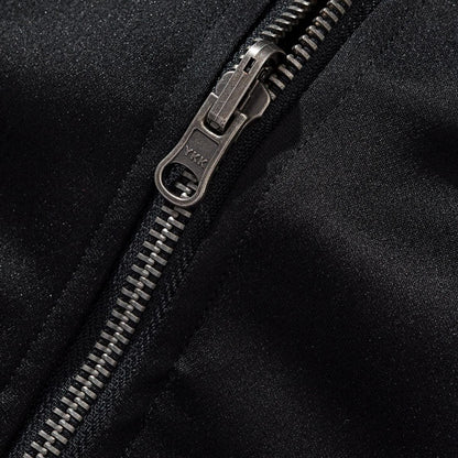 YKK metal zipper pull close-up with sturdy teeth on sukajan jacket